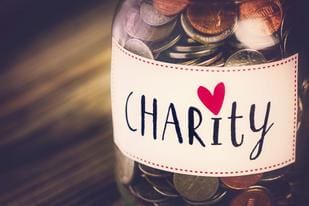 Charity jar filled with coins